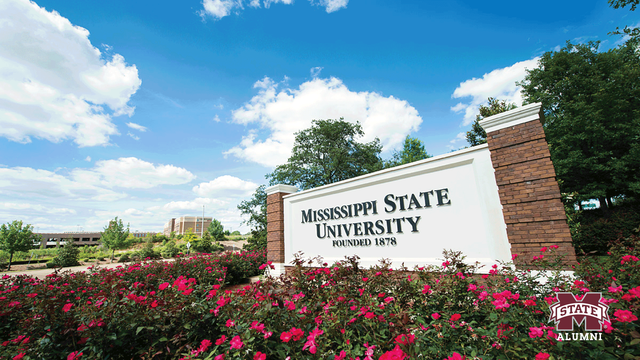 Picture of the Mississippi State University sign with a bed of roses around it